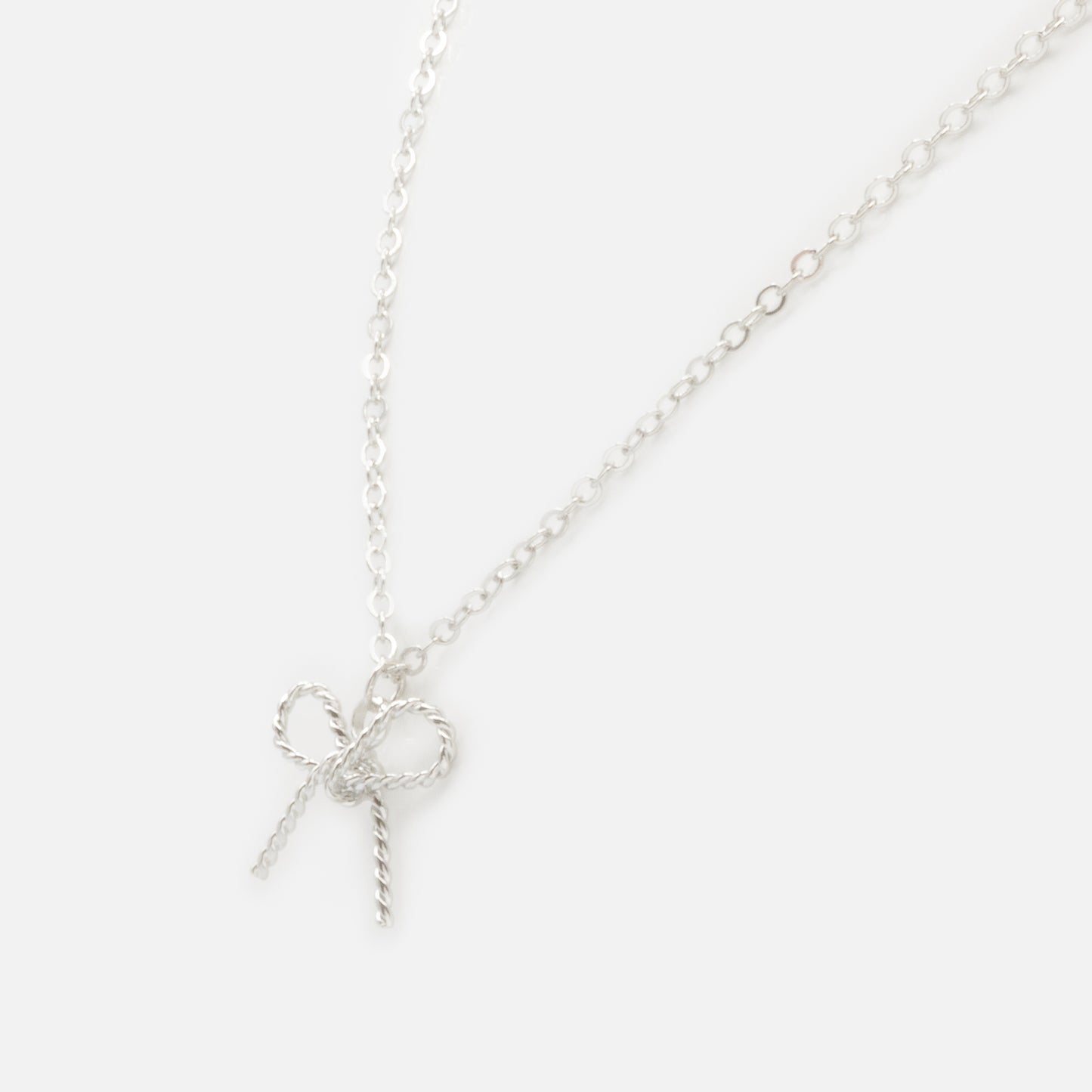 FS253N034SL - Bow shaped charm silvered necklace