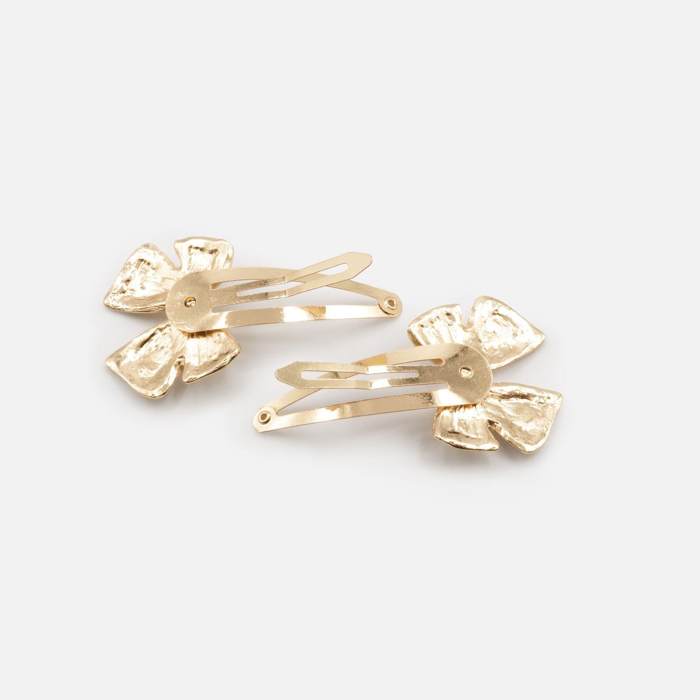 HA253C004GL - Golden metal clips duo with bow
