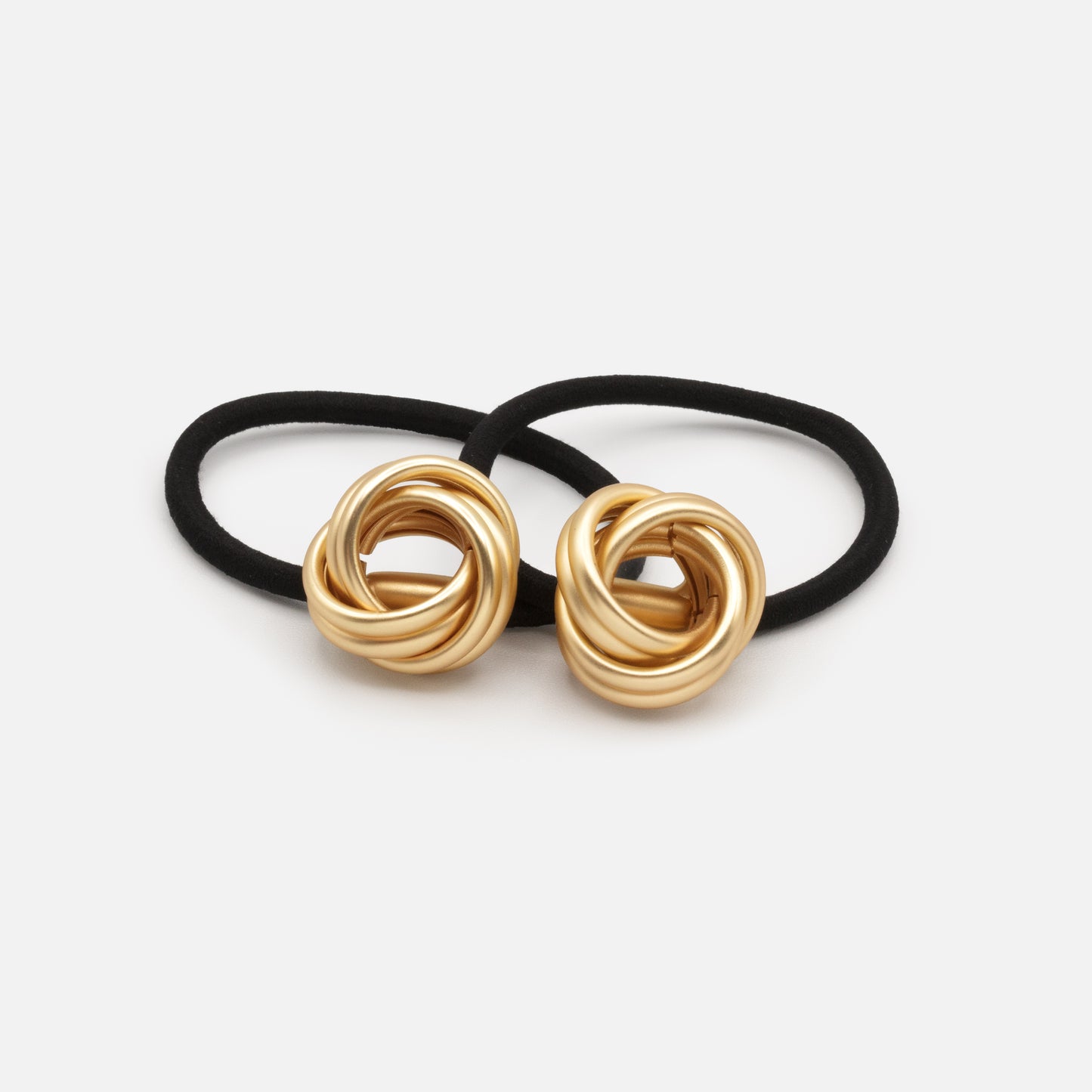 HA253E040GL - Black elastic duo with mat golden metal ornament