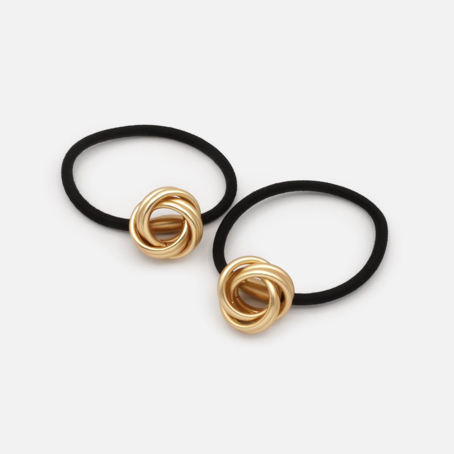 HA253E040GL - Black elastic duo with mat golden metal ornament