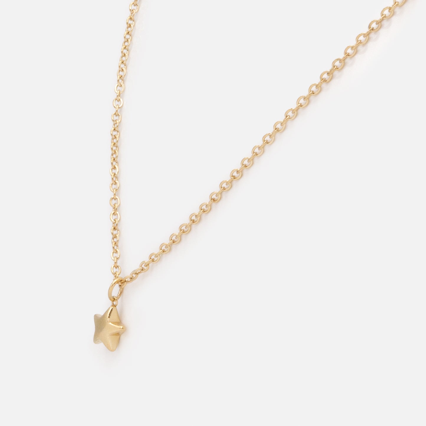 MN253N008GL - Mini golden star necklace in stainless steel