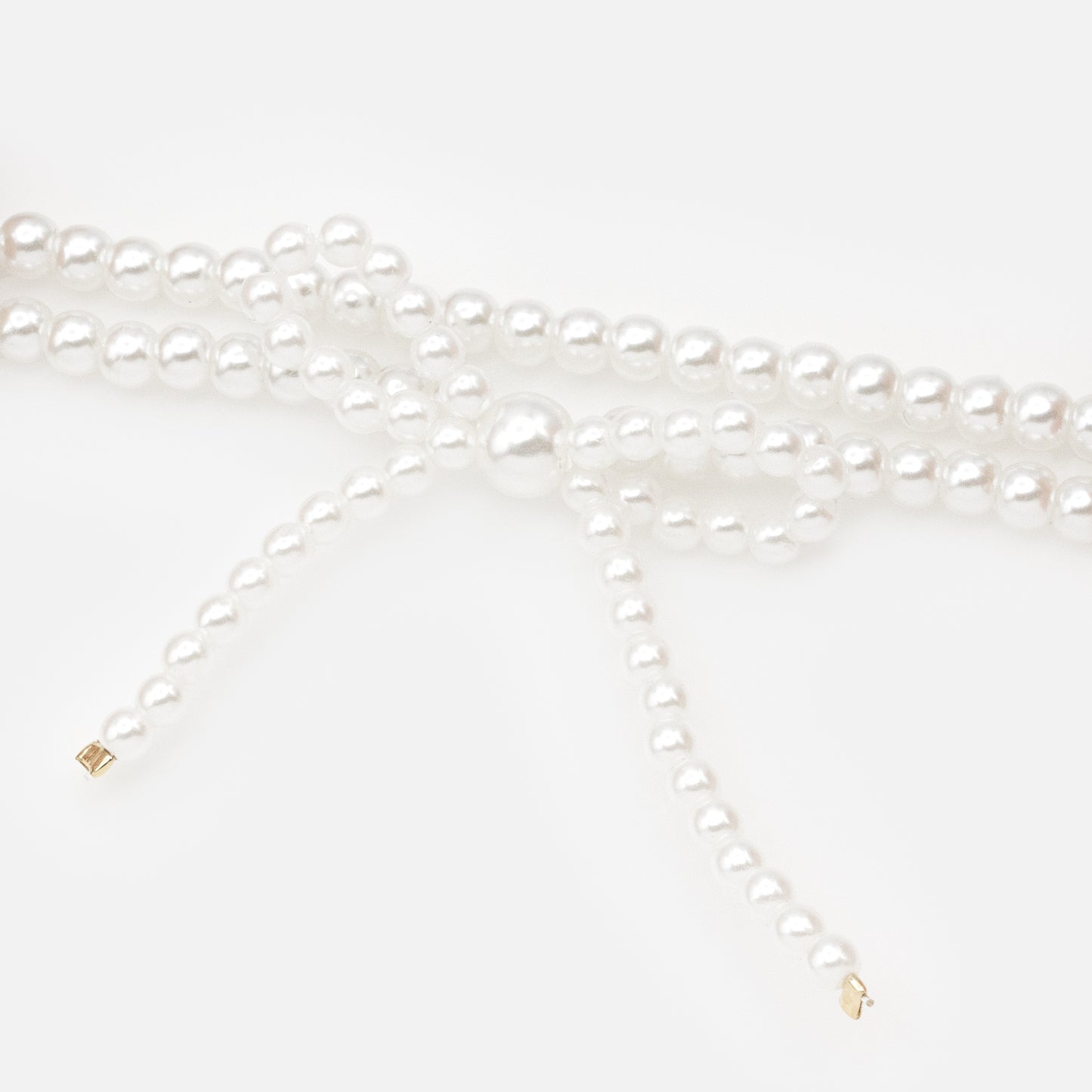 PL253B023GL - Elastic pearl bracelet with bow