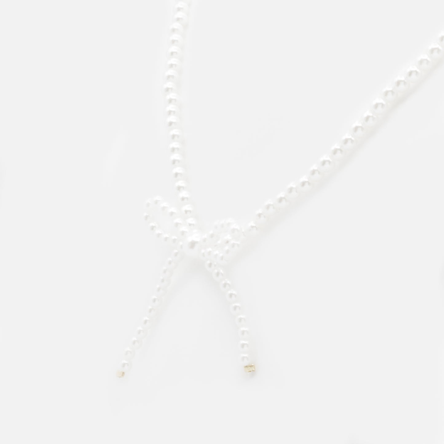 PL253N018GL - Pearl necklace with side bow