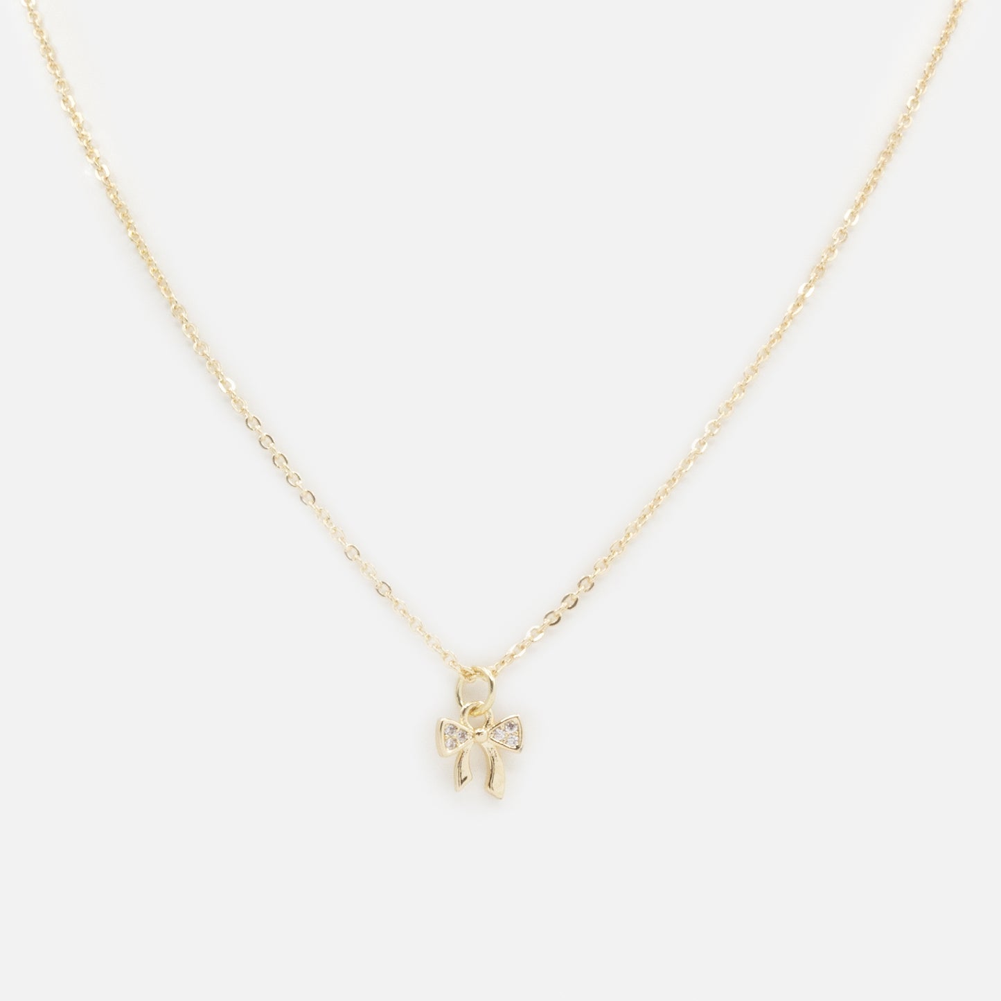 PR253N030GL - Small bow charm golden necklace with cubic zirconia