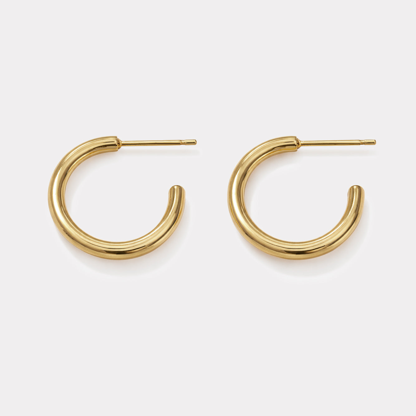 Golden hoop earrings with grooves in stainless steel - SS253E004GL
