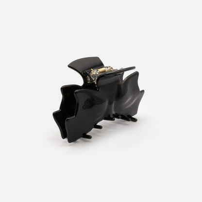 HA253W031BK - Pince noire en forme de boucle en plastique au fini lustré