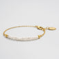 Delicate Gold-Tone Bracelet with Asymmetric Pearl Row