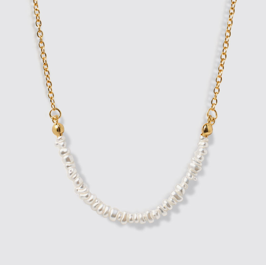 Delicate Golden Necklace with Asymmetric Pearl Row