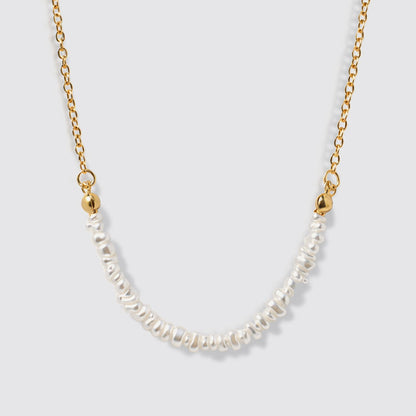 Delicate Golden Necklace with Asymmetric Pearl Row