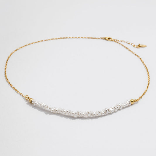 Delicate Golden Necklace with Asymmetric Pearl Row