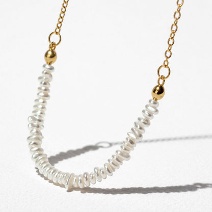 Delicate Golden Necklace with Asymmetric Pearl Row