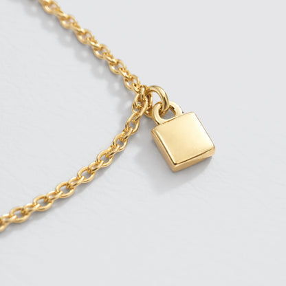 Gold-Tone Charm Bracelet with Small Square Charms