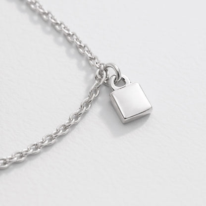Silver-Tone Charm Bracelet with Small Square Charms