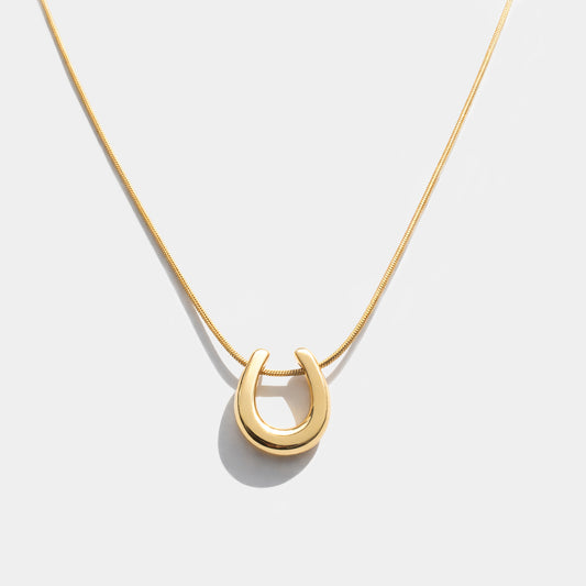 Horseshoe charm golden necklace in stainless steel