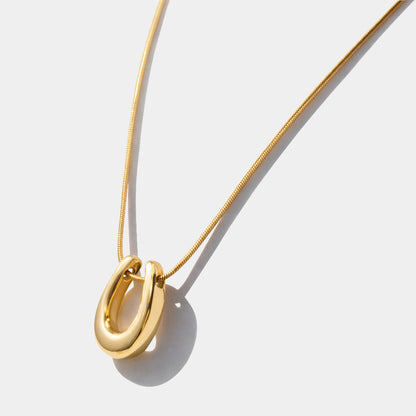 Horseshoe charm golden necklace in stainless steel